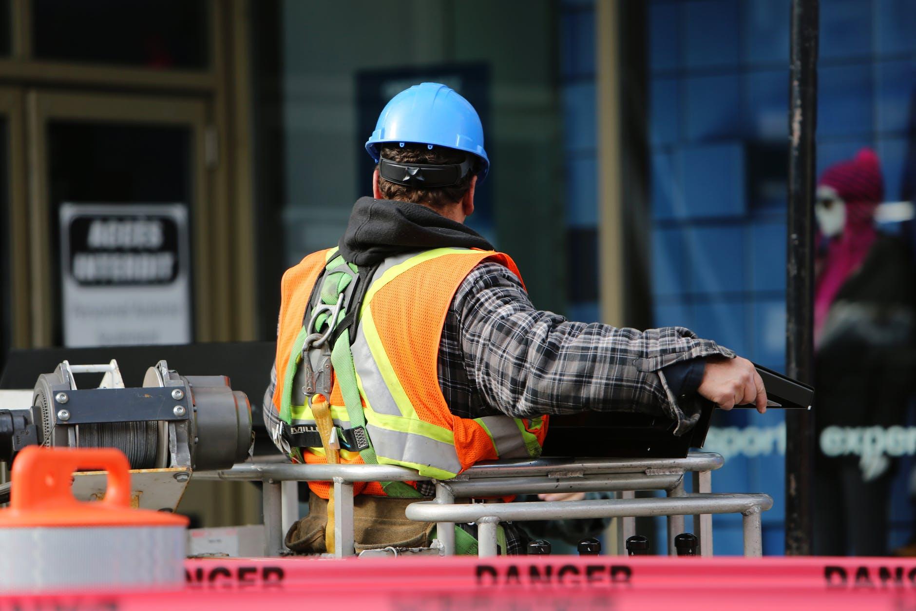 man wearing hard hat standing, waste management